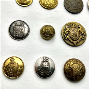Twenty assorted Livery coat of arms buttons and one Scottish kilt button.
