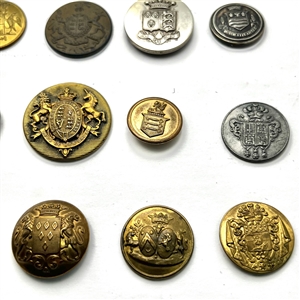 Twenty assorted Livery coat of arms buttons and one Scottish kilt button.
