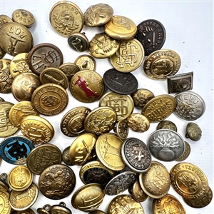 One hundred and seven assorted uniform buttons.
