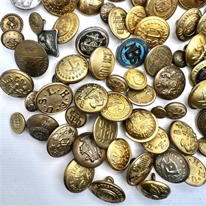 One hundred and seven assorted uniform buttons.