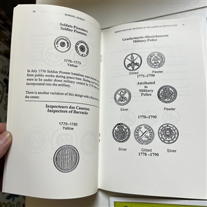 Seven button reference booklets.