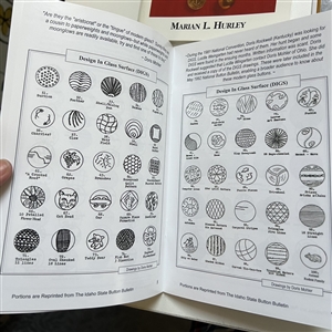 Seven button reference booklets.