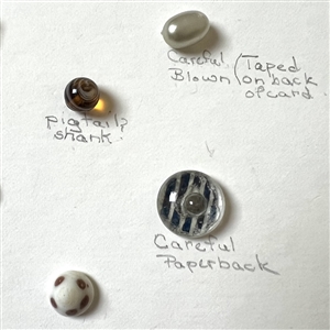 Card of 39 small and diminutive size assorted glass buttons.