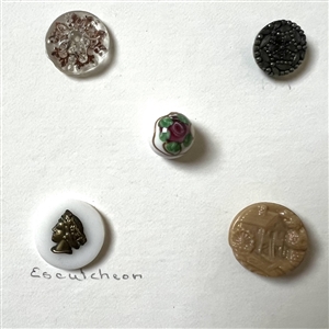 Card of 39 small and diminutive size assorted glass buttons.