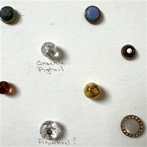 Card of 39 small and diminutive size assorted glass buttons.