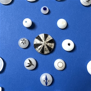 Card of 34 assorted clam broth glass buttons.