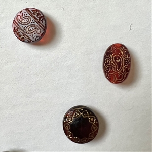 Card of 30 ruby and red glass buttons.