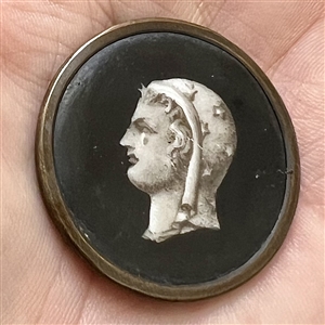 A 19th c. Liverpool transfer button of woman wearing a scarf of stars.