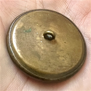 A 19th c. Liverpool transfer button of woman wearing a scarf of stars.