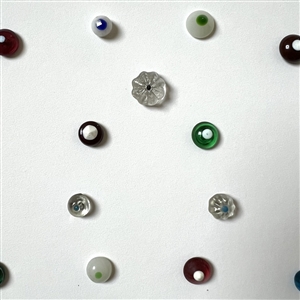 Card of 35 small and diminutive glass swirl back buttons.