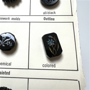 Card of 36 black glass classification buttons.