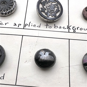 Card of 36 black glass classification buttons.