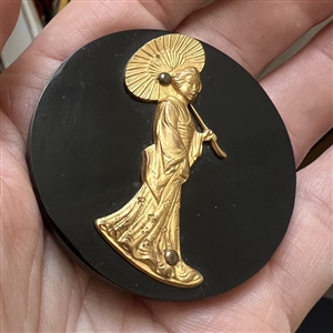 Extra large Vintage casein button with gilded escutcheon of a geisha.