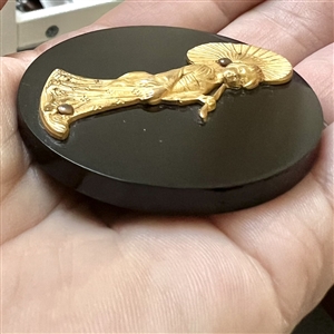 Extra large Vintage casein button with gilded escutcheon of a geisha.