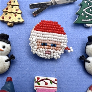 Nine assorted Christmas and winter themed buttons.