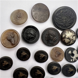 Group of 24 assorted horn and wood buttons. 