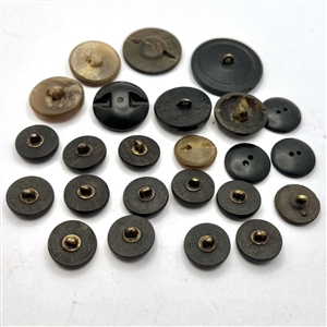 Group of 24 assorted horn and wood buttons. 
