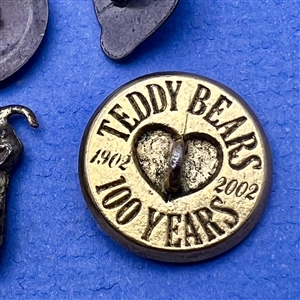 Six teddy bear and elephant buttons.