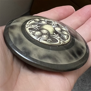 Huge celluloid tight top button with an Ivoroid center.