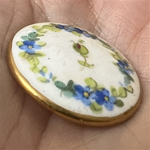A 19th c. Staffordshire England Mintons painted porcelain button of flowers.