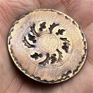 An 18th c. heavily chased copper Colonial button.