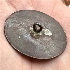 An 18th c. heavily chased copper Colonial button.