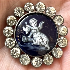 “En grisaille” 19th c. enamel button of cherub holding a dove upside down.