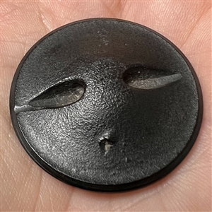 A 19th c. Large molded black horn button of FOP couple.