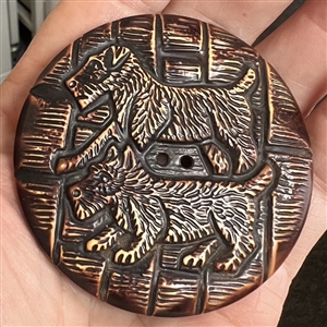 Extra large buffed celluloid button of scotty dogs.