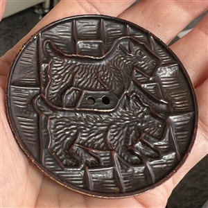 Extra large buffed celluloid button of scotty dogs.
