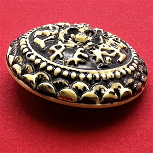 Vintage painted plastic “Diamond D” button.
