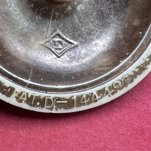 Vintage painted plastic “Diamond D” button.