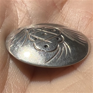Sterling silver pinecone button.