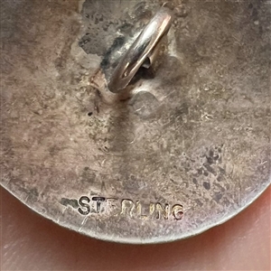 Sterling silver pinecone button.