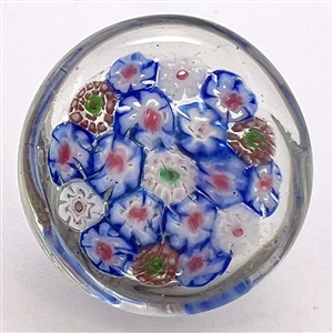 1939 Worlds Fair glass paperweight button of flowers.