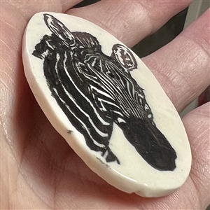 Ceramic studio button of a zebra by Diana M.B.