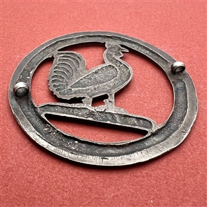 White metal Livery trim of a rooster.