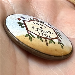 A 19th c. polychrome enamel button commemorating the French Revolution.