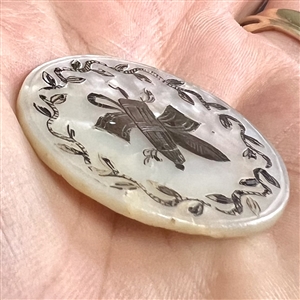 A 19th c. Pearl with incised and silvered French design.
