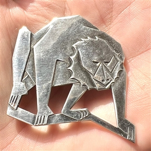 Vintage French white button of a baboon in an Art Deco style.