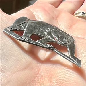 Vintage French white button of a baboon in an Art Deco style.