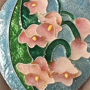 Diana Wieler enamel studio button of pink lily of the valley.