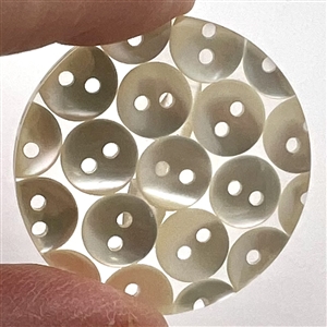 Tiny pearl buttons encased in acrylic button.
