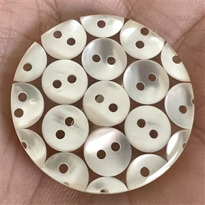Tiny pearl buttons encased in acrylic button.