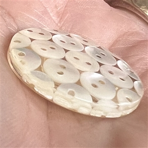 Tiny pearl buttons encased in acrylic button.