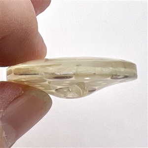 Tiny pearl buttons encased in acrylic button.