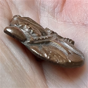 Realistic Queen of Hearts tinted copper button. 