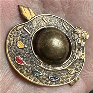 Brass button of realistic artist's pallet.