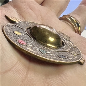 Brass button of realistic artist's pallet.