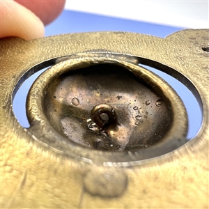 Brass button of realistic artist's pallet.